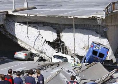 Rescue workers at the scene of a collapsed highway overpass road in the Montreal suburb of Laval