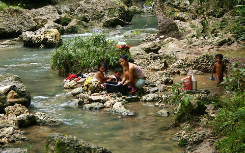 Hagimit locals children, domestic chores, Philippines woman washing clothes laundry river woman rural children bathing Davao