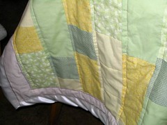 yellow-green quilt with binding