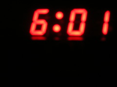 wake up. take exactly one minute to turn on camera and take picture of clock.