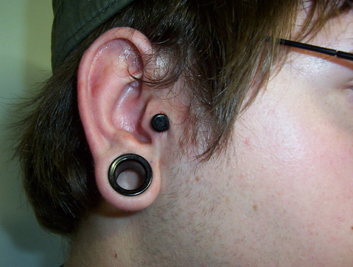 6g initial tragus piercing. Black color-front glass plug from Glasswear 