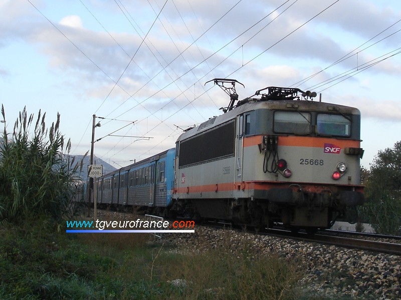 A BB25500 electric locomotive with the new SNCF logo on a push-pull service towards the station of La Penne-sur-Huveaune