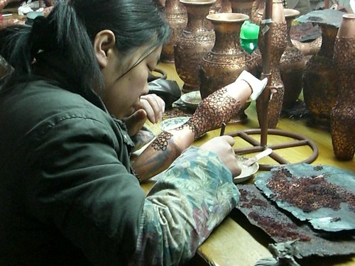 Copper vase workers