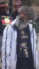 Adrian Walker gazes at Casino Towers, the building that used to hold the hated Native Affairs department - Justice for Mulrunji Rally at Queens Park and March through Brisbane City, Australia, November 18 2006