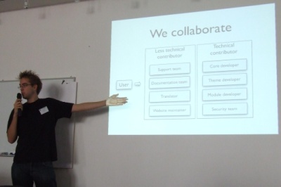 picture of a person presenting with a we collaborate slide