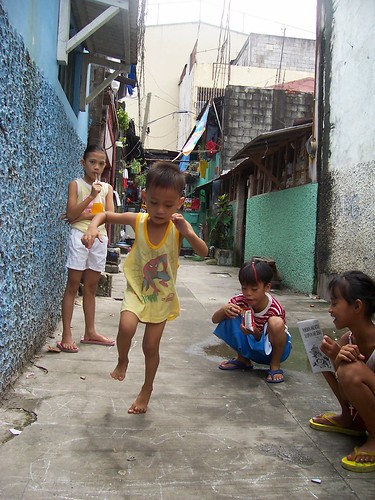  young girls and boy playing a piko, traditional game, street scene  Philippines Buhay Pinoy  Filipino Pilipino  people pictures photos life Philippinen      