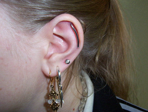  industrial piercing with a curve 