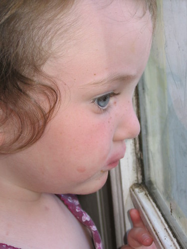 Trin watching her sisters play outside
