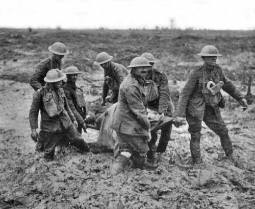 PASSCHENDAELE: Stretcher bearers struggling through the mud near Boesinghe, Belgium. August 1, 1917