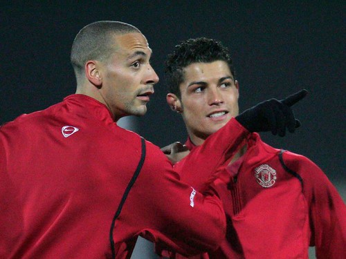 Rio Ferdinand and Cristiano Ronaldo of Manchester United in action during a first team training