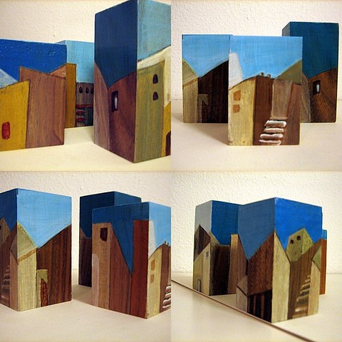Vier opstellingen van blokjes: "stad"