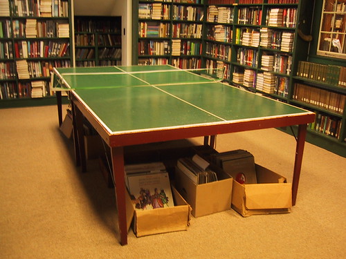 Image of a Ping Pong table in the middle of a library
