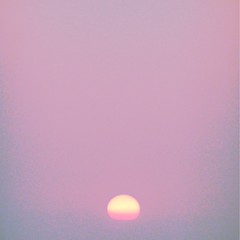 The sea, a sunset and haze