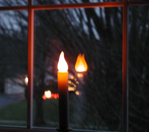 window candle at dawn