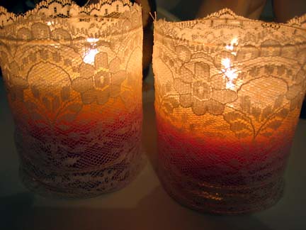 The candles with their new lace cozies