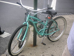 a sea green bike
