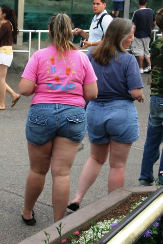 Two fat women in denim shorts and tees