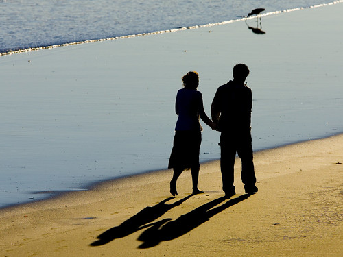 2 people holding hands at beach. 2-people-each-shadows-001