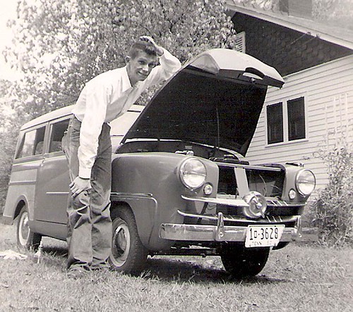 A station wagon with a little propeller on the grill Crosley with hood up