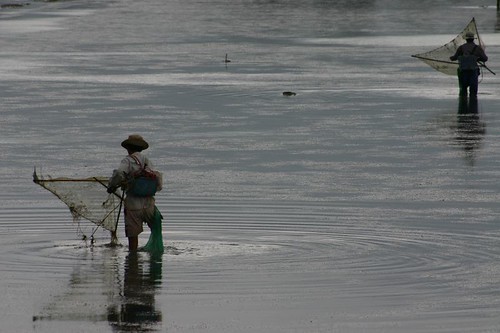 Local fishermen at work in the dammed lake...