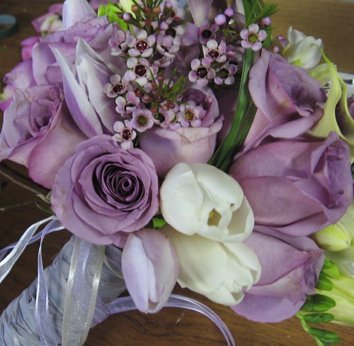 Purple themed wedding accented with white and green bear grass calla lily 