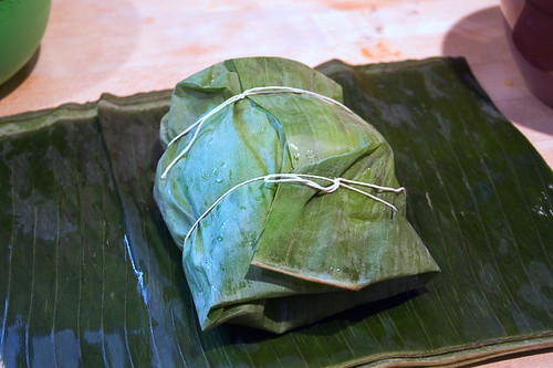 Wrap tamal up in banana leaves and tie with string