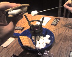 Toasting s'mores at Kayaks Coffee