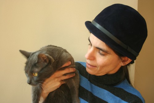 Self portrait with vintage hat and unwilling cat