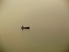 The old fisherman and foggy Garda...