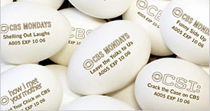 Photo of ads for CBS shows stamped on supermarket eggs. From New York Times Article.