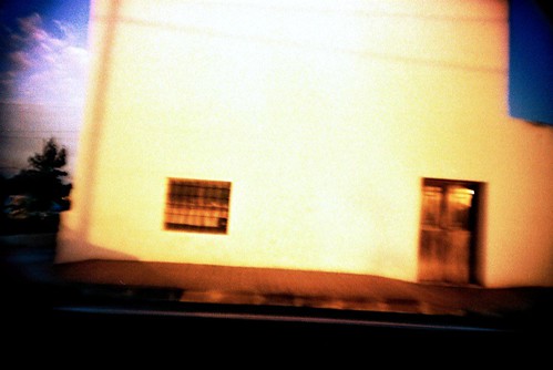 photo of house on speeding car
