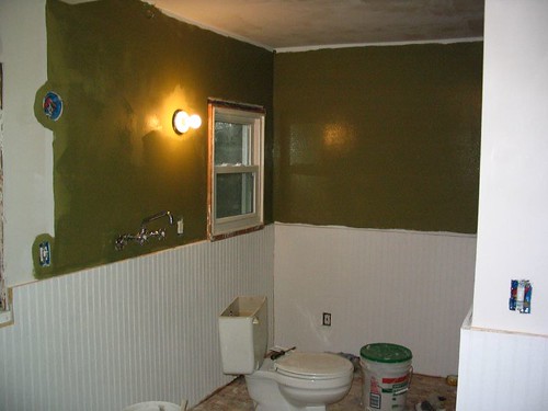 Bathroom with first coat of green paint