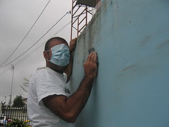 Sukh sanding the wall