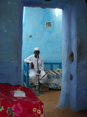 Relaxing as tourist explore his home - man in nubian village