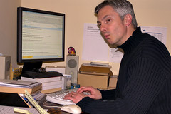 Photo of Ben in front of his computer while editing a Google Docs documment