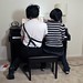 simon and ama playing piano