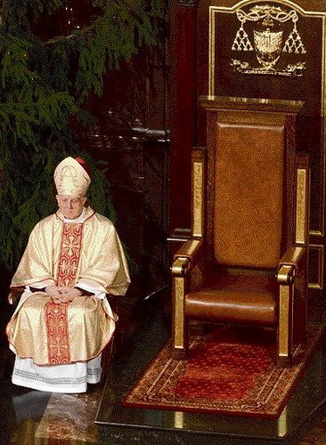 Warsaw's new archbishop Stanislaw Wielgus sits beside the empty throne in St John's Cathedral, during a Mass in Warsaw, Poland, Sunday, Jan. 7, 2007. Wielgus resigned Sunday amid a scandal over his involvement with the communist-era secret police. Wielgus announced his decision at the Cathedral, packed with worshippers gathered for a Mass that was to have marked his formal installation.  (AP Photo/ Alik Keplicz)