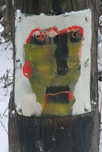Painting on telephone pole--back alley Hyde Park
