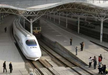 A bullet train pulls in at a railway station in Shanghai