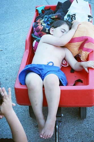 Asleep in a red wagon
