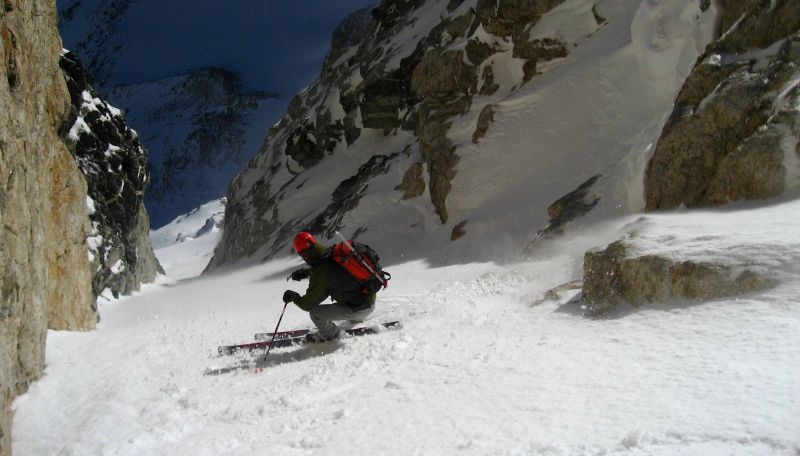 Dustin skis towards the narrows of the Chouinard