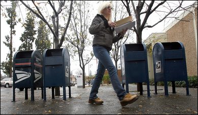 Carrie Fischer of Santa Rosa prepares to mail a letter at the Santa Rosa downtown post office.