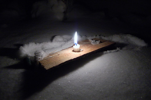 One small candle in the snow