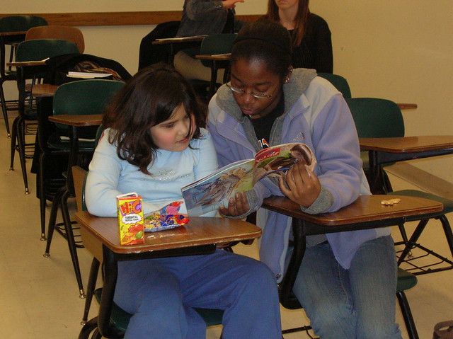Mentors Reading with Children at Purdue College Mentors for Kids