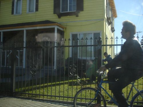 riding past the yellow house