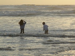 Ruthie and Gage playing in the waves