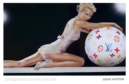 sexy Eva Herzigova posing with a huge aerobic exercise ball