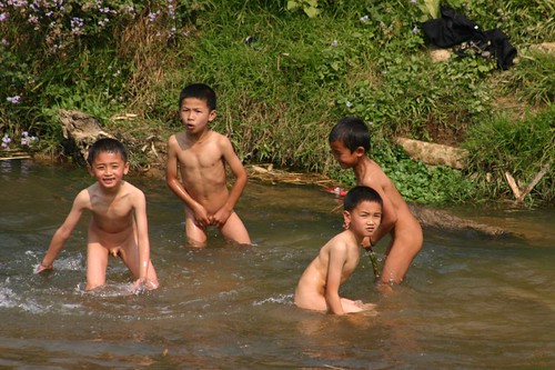 Naked boys playing in the river Xam Neau 2007