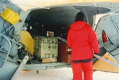 Loading up the cargo haul of the helicopter
