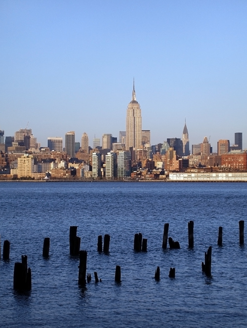 old NJ pier ruins with Empire State Building